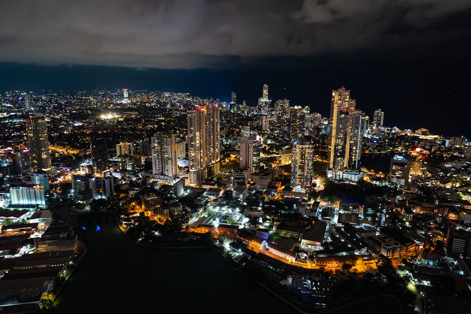 A captivating aerial view of Colombo's cityscape at night, showcasing its vibrant lights and towering skyscrapers.